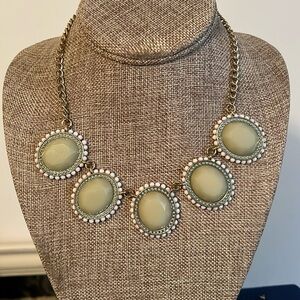 Green and white necklace, set in gold tone